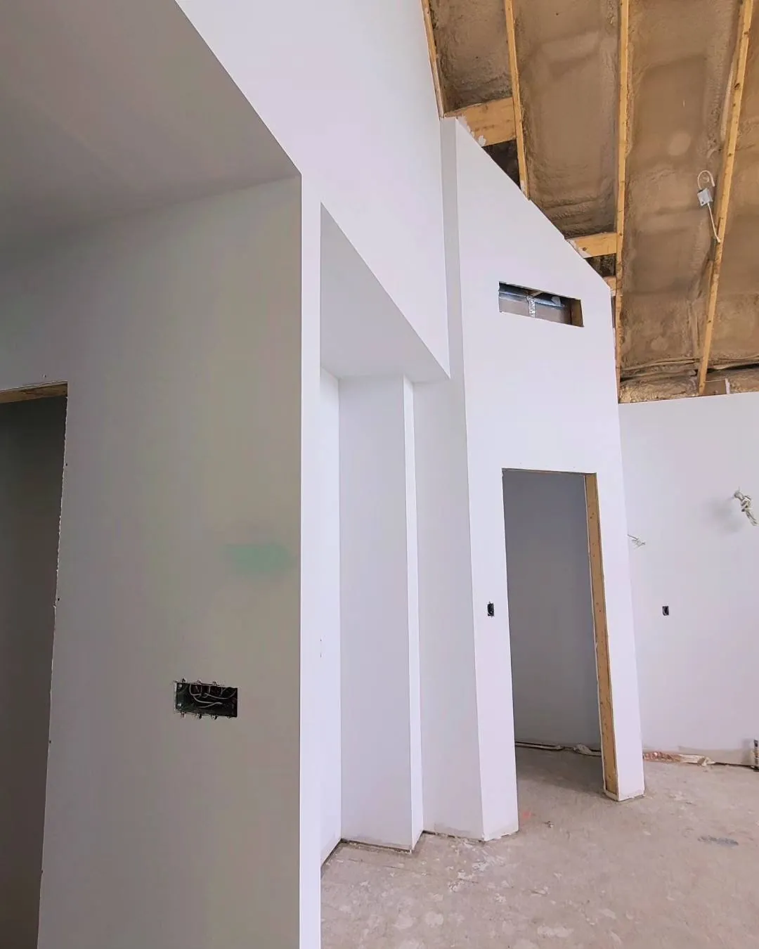 Drywall installation in a new home addition in Hamilton